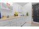 Bright bathroom with a double sink vanity, framed mirror, and shower/tub combo at 1521 Oxford Rd, Maitland, FL 32751