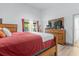 Comfortable main bedroom with a wooden bed frame, matching furniture, and access to the lanai at 1521 Oxford Rd, Maitland, FL 32751
