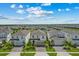 Aerial view of neighborhood showcasing well-maintained lawns, mature trees, and similar exterior home styles at 1697 Kona Ln, Davenport, FL 33897
