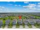 An aerial view showcases the desirable neighborhood and prime location of the home, complete with lush greenery and blue skies at 1697 Kona Ln, Davenport, FL 33897