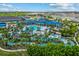 Aerial view of community pool and lazy river and blue rooftops of the resort area at 1697 Kona Ln, Davenport, FL 33897