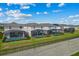 Backyard view of the home shows screened-in pools and green lawns, offering a private and relaxing outdoor retreat at 1697 Kona Ln, Davenport, FL 33897