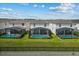 Backyard view of the home shows screened-in pools and green lawns, offering a private and relaxing outdoor retreat at 1697 Kona Ln, Davenport, FL 33897