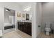 Bathroom featuring double sinks, granite countertops, and tile flooring at 1697 Kona Ln, Davenport, FL 33897
