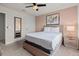 Cozy bedroom with a ceiling fan, a large bed with nightstands and tasteful decor at 1697 Kona Ln, Davenport, FL 33897