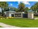 Elegant entrance to Windsor Island Resort features a stone monument, lush landscaping, and a welcoming atmosphere at 1697 Kona Ln, Davenport, FL 33897