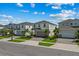 Charming two-story home features a well-manicured lawn, a two-car garage, and a welcoming front entrance at 1697 Kona Ln, Davenport, FL 33897