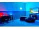 Inviting game room features an air hockey table, a large television, and comfortable beanbag chairs for entertainment at 1697 Kona Ln, Davenport, FL 33897