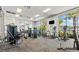 On-site gym with modern exercise equipment and large windows with outdoor views at 1697 Kona Ln, Davenport, FL 33897