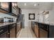 Modern kitchen with stainless steel appliances, granite countertops and tiled flooring at 1697 Kona Ln, Davenport, FL 33897