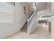 Carpeted staircase with white railing leading to the upper level at 1697 Kona Ln, Davenport, FL 33897