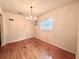 Bright dining room featuring hardwood floors and elegant chandelier lighting at 1951 S Crystal Lake Dr, Orlando, FL 32806