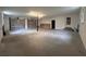 Spacious garage with two roll-up doors, concrete floor, and natural light from windows at 1951 S Crystal Lake Dr, Orlando, FL 32806