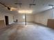 Spacious garage with concrete floor, overhead lighting, door to outside, and garage door opener at 1951 S Crystal Lake Dr, Orlando, FL 32806