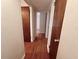 Hallway featuring hardwood floors and classic wood doors at 1951 S Crystal Lake Dr, Orlando, FL 32806
