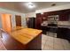 Functional kitchen with stainless steel appliances and ample counter space, adjacent to island at 1951 S Crystal Lake Dr, Orlando, FL 32806