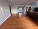 Sunlit living room featuring hardwood floors, seamlessly connecting to the dining area at 1951 S Crystal Lake Dr, Orlando, FL 32806