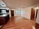 Spacious living room with beautiful wood floors, open to kitchen and entry at 1951 S Crystal Lake Dr, Orlando, FL 32806