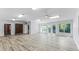 Bright bonus room with tile floors, high ceilings, and multiple ceiling fans at 214 Schooner Ave, Edgewater, FL 32141