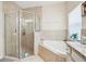 Bathroom featuring a large walk-in shower and corner tub at 310 Villa Sorrento Cir, Haines City, FL 33844