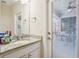 Small bathroom with granite countertop and door to patio at 310 Villa Sorrento Cir, Haines City, FL 33844
