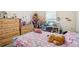 bedroom with unicorn bedding and wood furniture at 310 Villa Sorrento Cir, Haines City, FL 33844