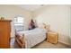 Bedroom with wooden bed frame and dresser at 310 Villa Sorrento Cir, Haines City, FL 33844