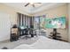 Bedroom with large TV, gaming setup and sliding doors at 310 Villa Sorrento Cir, Haines City, FL 33844