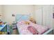 bedroom with unicorn bedding and wood furniture at 310 Villa Sorrento Cir, Haines City, FL 33844