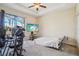 Bedroom with large TV, gaming setup and sliding doors at 310 Villa Sorrento Cir, Haines City, FL 33844