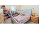 bedroom with unicorn bedding and wood furniture at 310 Villa Sorrento Cir, Haines City, FL 33844