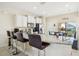 Granite countertop kitchen island with seating and stainless steel appliances at 310 Villa Sorrento Cir, Haines City, FL 33844