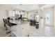 Kitchen island with seating, granite countertops, and stainless steel appliances at 310 Villa Sorrento Cir, Haines City, FL 33844
