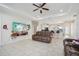 Living room with open floor plan, leather couches, and large TV at 310 Villa Sorrento Cir, Haines City, FL 33844