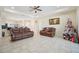 Open living room with leather sofas and view into kitchen area at 310 Villa Sorrento Cir, Haines City, FL 33844