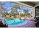 Inviting pool and spa with screened enclosure at 310 Villa Sorrento Cir, Haines City, FL 33844