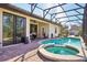 Inviting pool and spa with screened enclosure at 310 Villa Sorrento Cir, Haines City, FL 33844