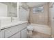 Bathroom featuring a white vanity, grey tile floors, tiled shower, and toilet at 409 Horizon Dr, Winter Springs, FL 32708