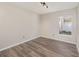 Empty bedroom with wood-look flooring, neutral paint, and lots of natural light at 409 Horizon Dr, Winter Springs, FL 32708