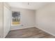 Bedroom featuring wood floors, a window, white walls, and a closet at 409 Horizon Dr, Winter Springs, FL 32708