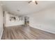Open-concept living room and kitchen space with bar seating and sliding door access to outdoor area at 409 Horizon Dr, Winter Springs, FL 32708