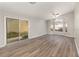 Bright living room featuring wood floors, a ceiling fan, and sliding glass doors to the outside at 409 Horizon Dr, Winter Springs, FL 32708