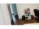 Bright bedroom with hardwood floors and open door at 737 Trillium Ct, Debary, FL 32713