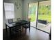 Dining area with sliding glass doors leading to the backyard at 737 Trillium Ct, Debary, FL 32713