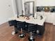 Kitchen island with seating for three and quartz countertop at 737 Trillium Ct, Debary, FL 32713