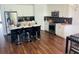 Modern kitchen with white cabinets, island, and stainless steel appliances at 737 Trillium Ct, Debary, FL 32713
