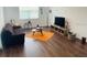 Living room with brown sofa and a modern coffee table at 737 Trillium Ct, Debary, FL 32713