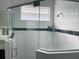 Large walk-in shower with glass enclosure and window at 737 Trillium Ct, Debary, FL 32713