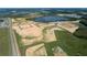 Aerial view of a new residential community with a lake at 16875 Muskgrass Dr, Winter Garden, FL 34787