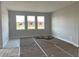 Bright, neutral-toned living room with recessed lighting and large windows at 16875 Muskgrass Dr, Winter Garden, FL 34787